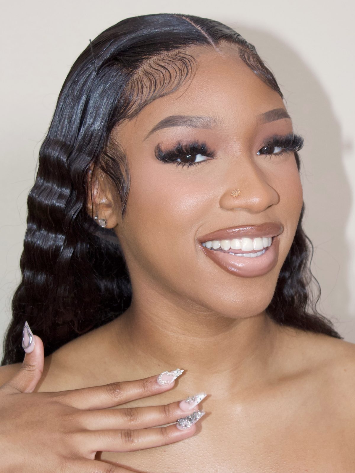 Client in BMore Beauté glam: soft brown smoky eye, full lashes and a glossy nude lip