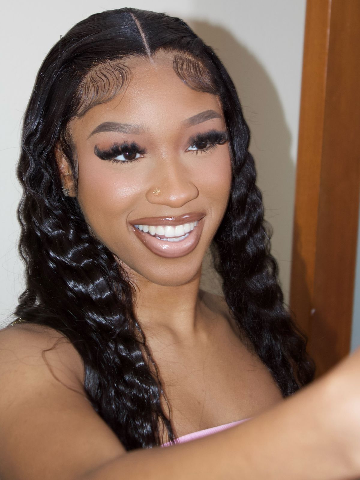 Full glam with lashes and a glossy nude lip